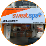 image showing the front store look of Seberang Jaya outlet with bright orange signage written sweatspa name, with phone number in circle frame